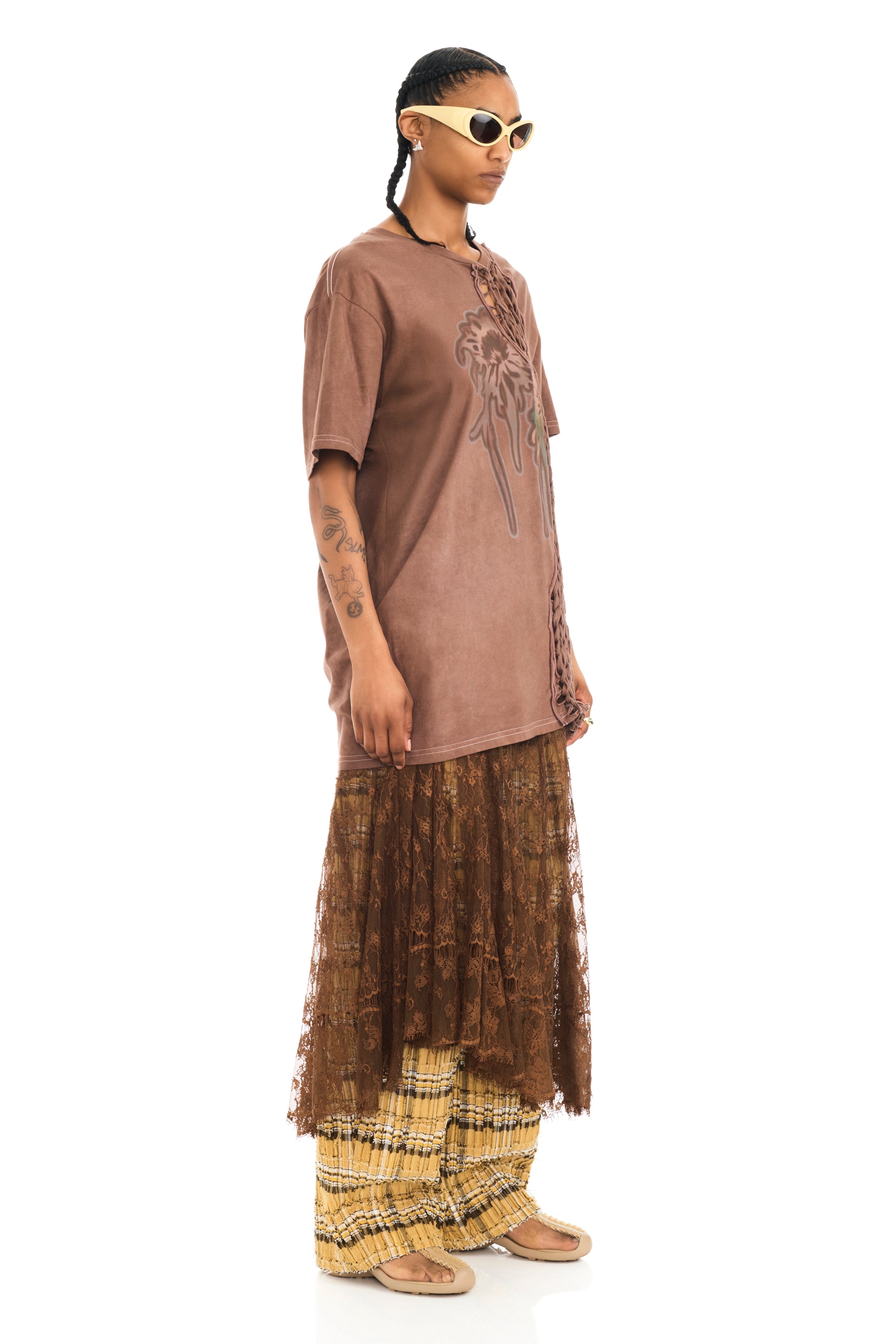 Tee with raw edge openings and knitted detail. Earth Faded Flower graphic on front.