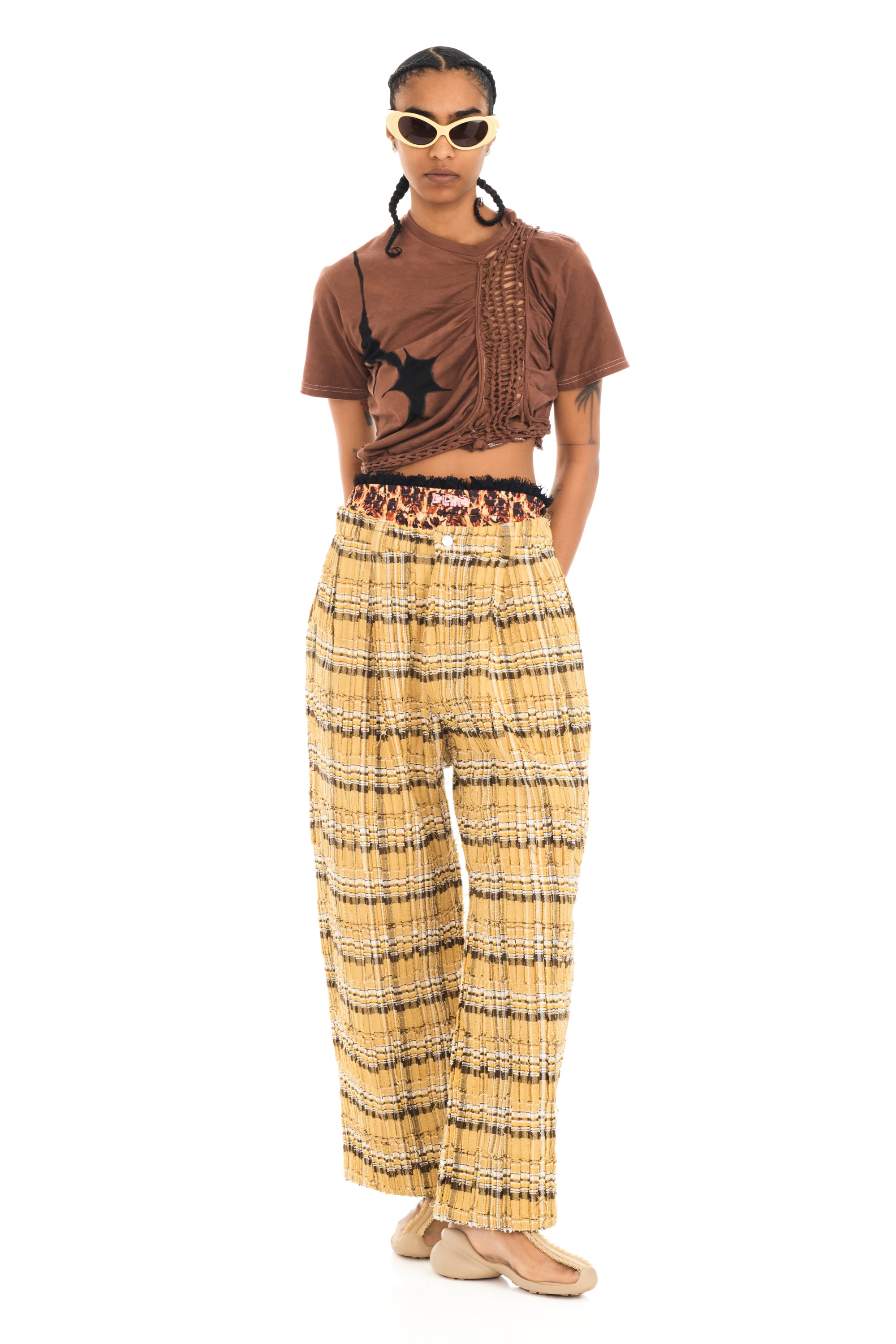 Cropped t-shirt with knitted braiding details and design on front. Hand painted.