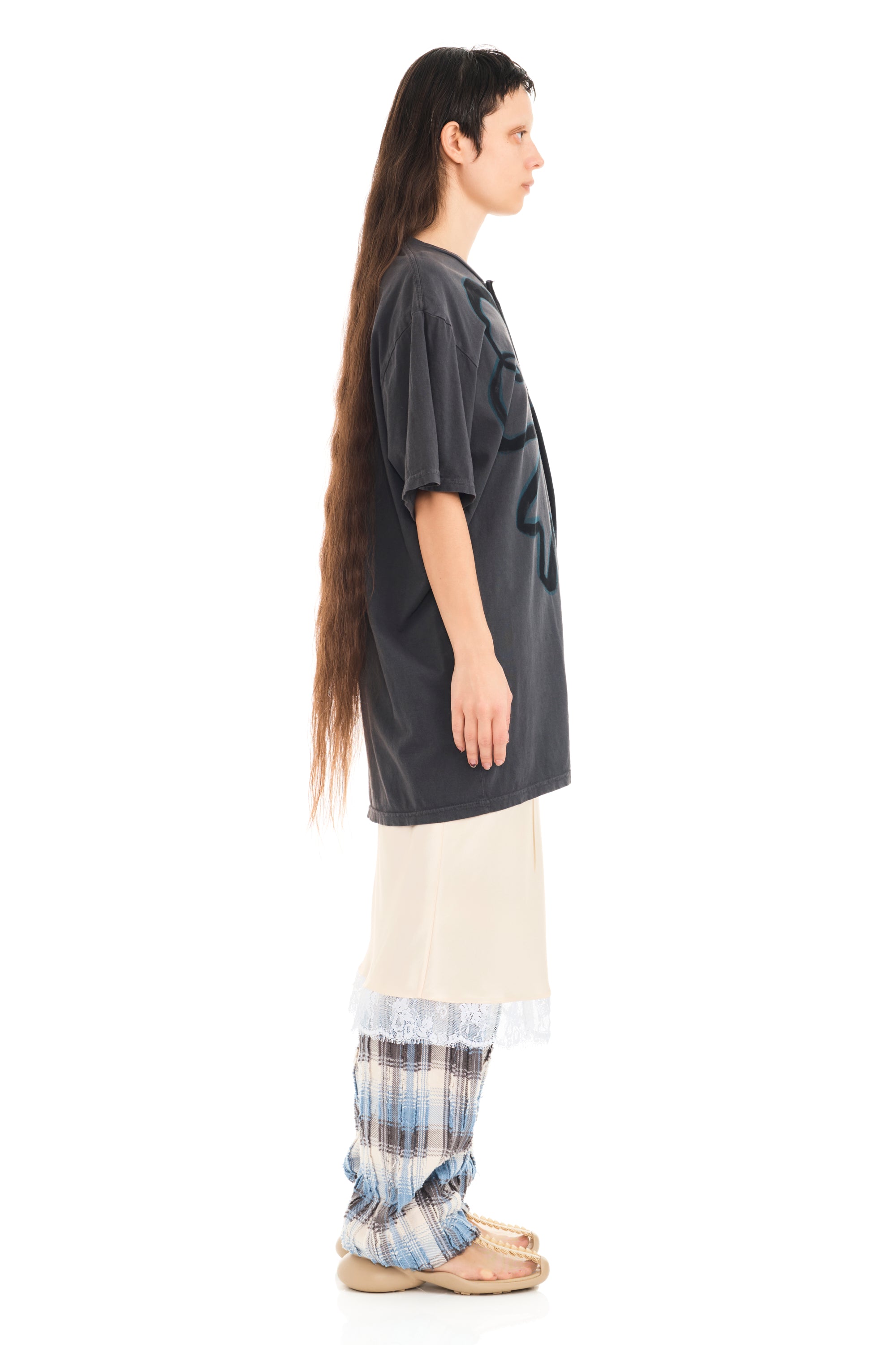 Tee with raw edge openings and knitted detail. Flower design on front.