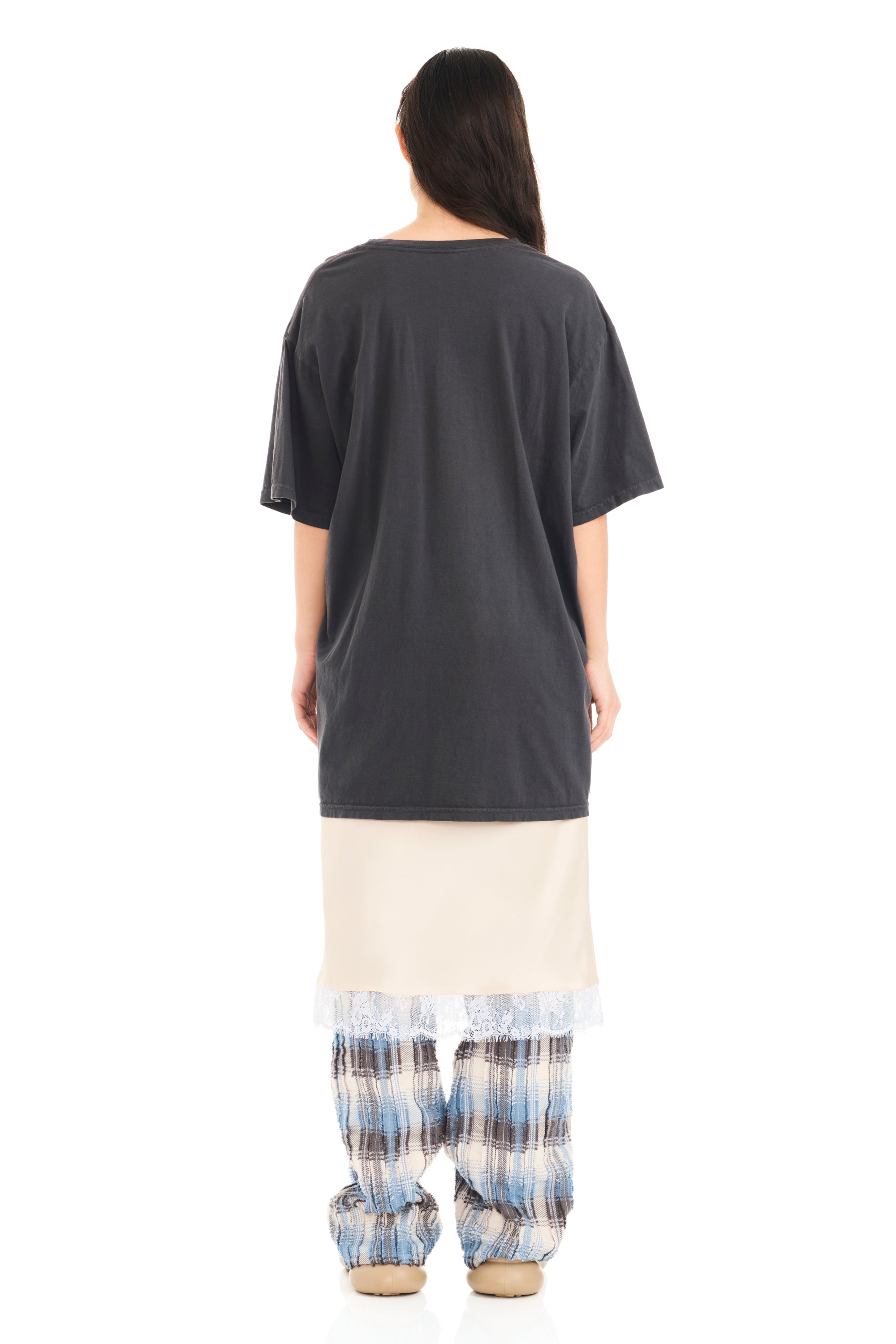 Tee with raw edge openings and knitted detail. Flower design on front.