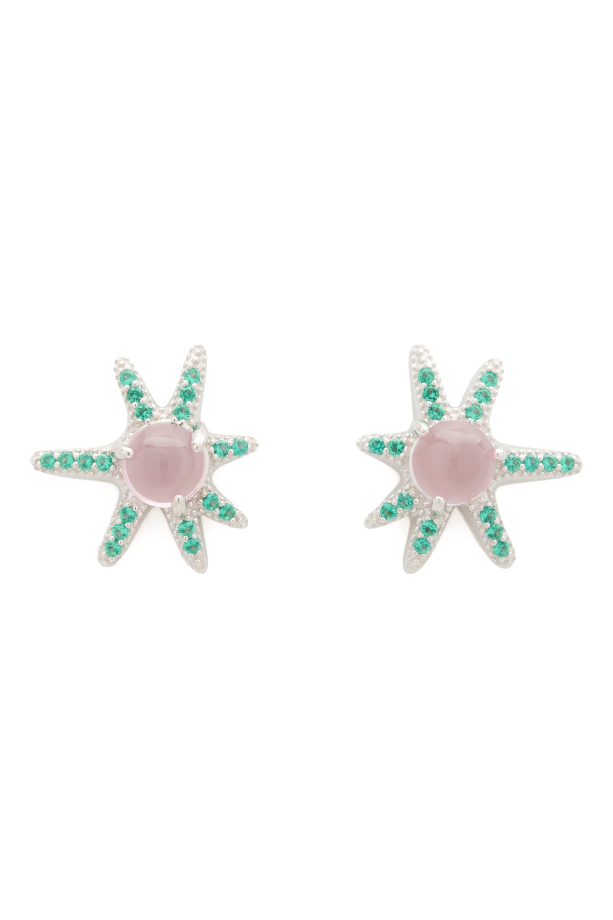 Star-shaped earrings with green gemstones on a white background