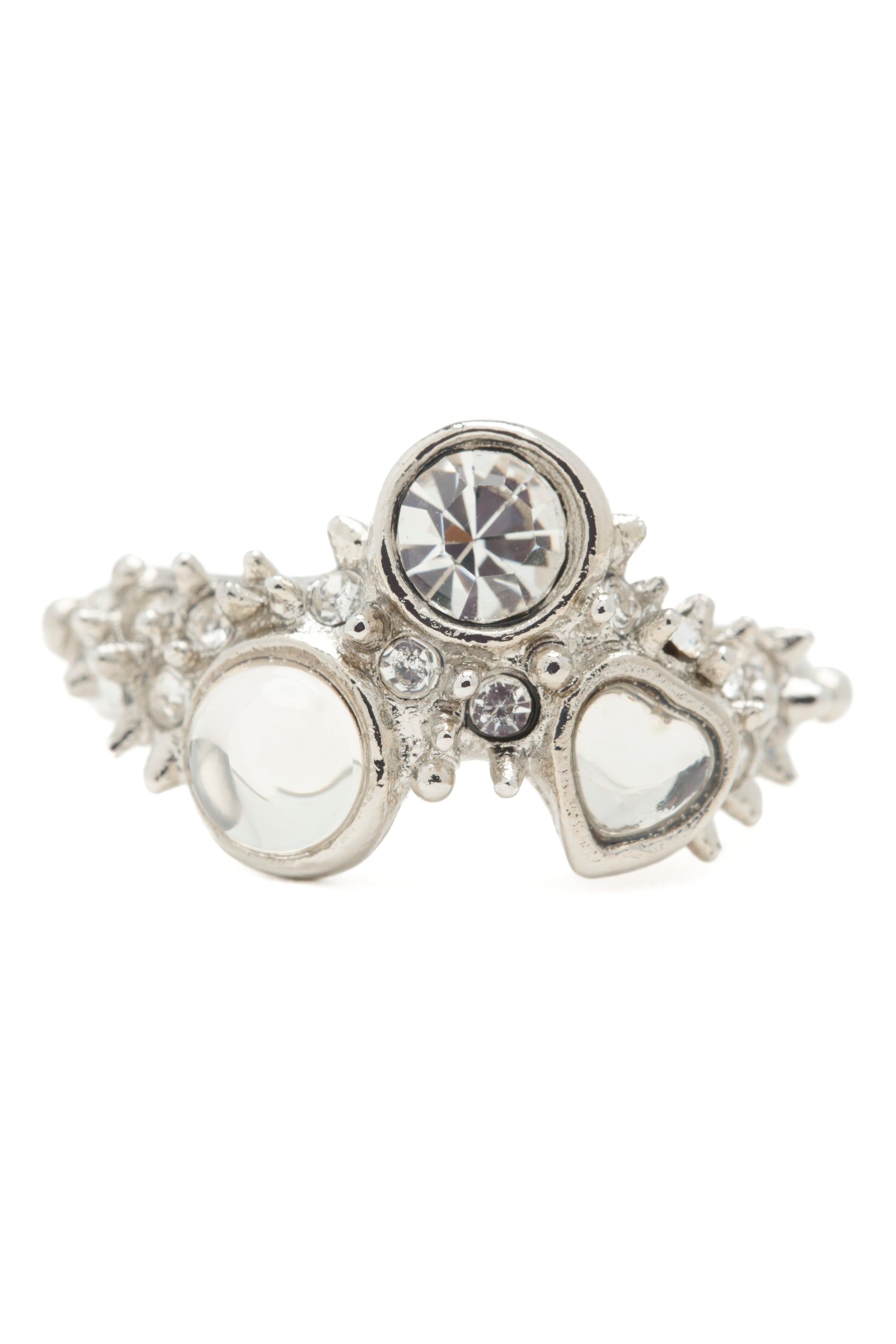 Decorative silver ring with clear gemstones and mini spikes on a white background