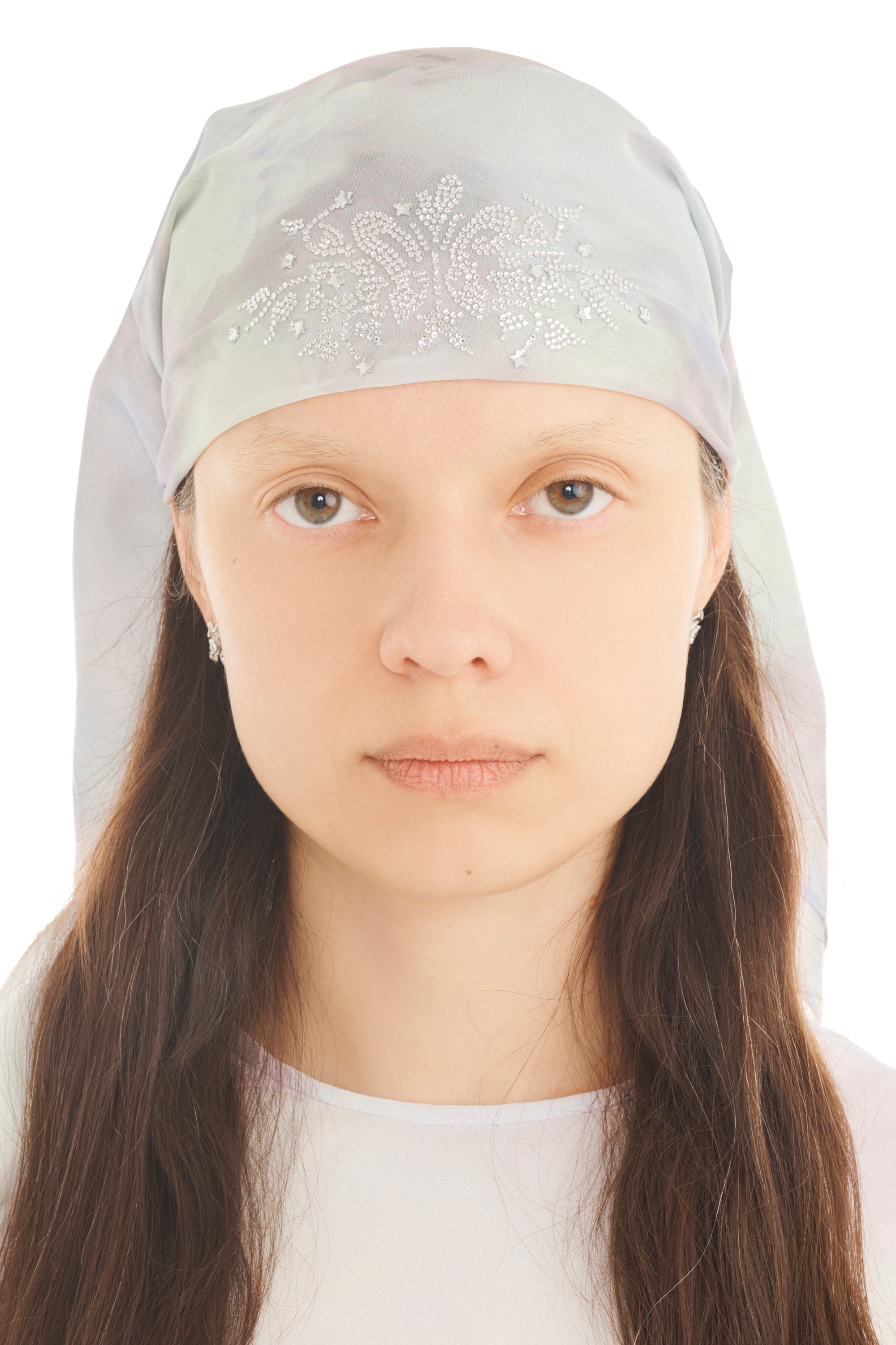 A model wears a light lilac printed foulard head scarf with rhinestone detailing on a white background