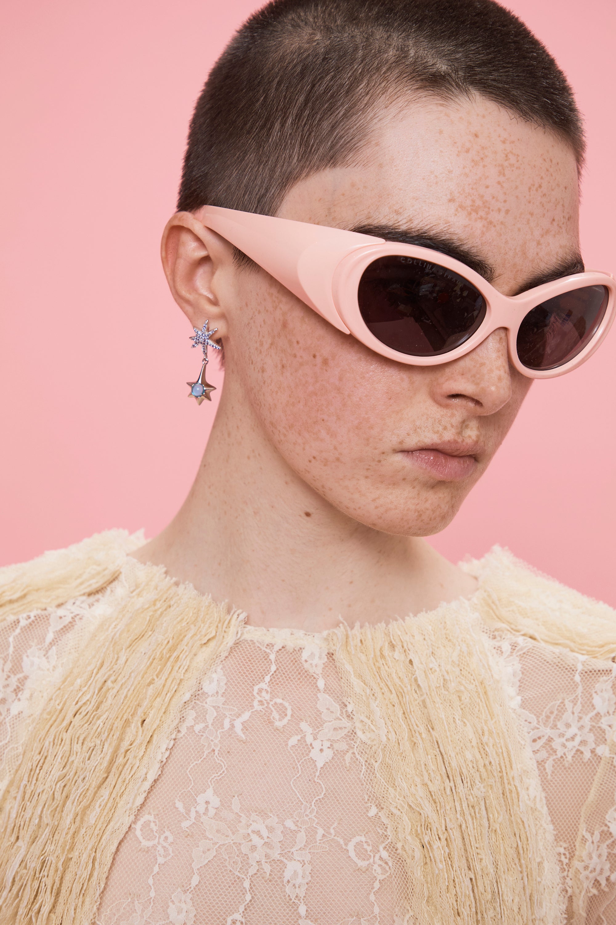 Lavender star drop earrings with blue rhinestone. Stud back.100% sterling silver and cubic zirconia