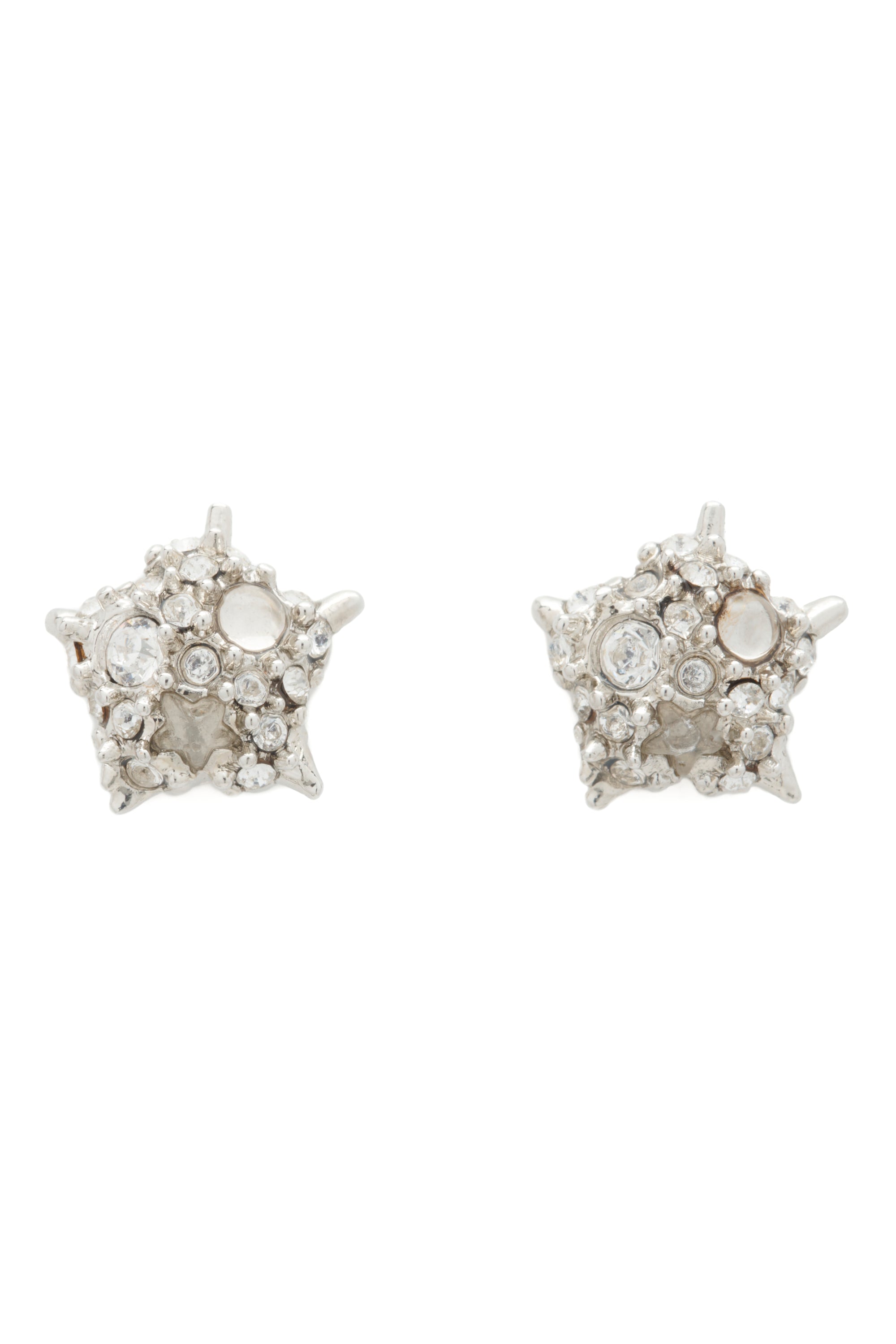 Star-shaped silver earrings with differently-sized clear stones on a white background