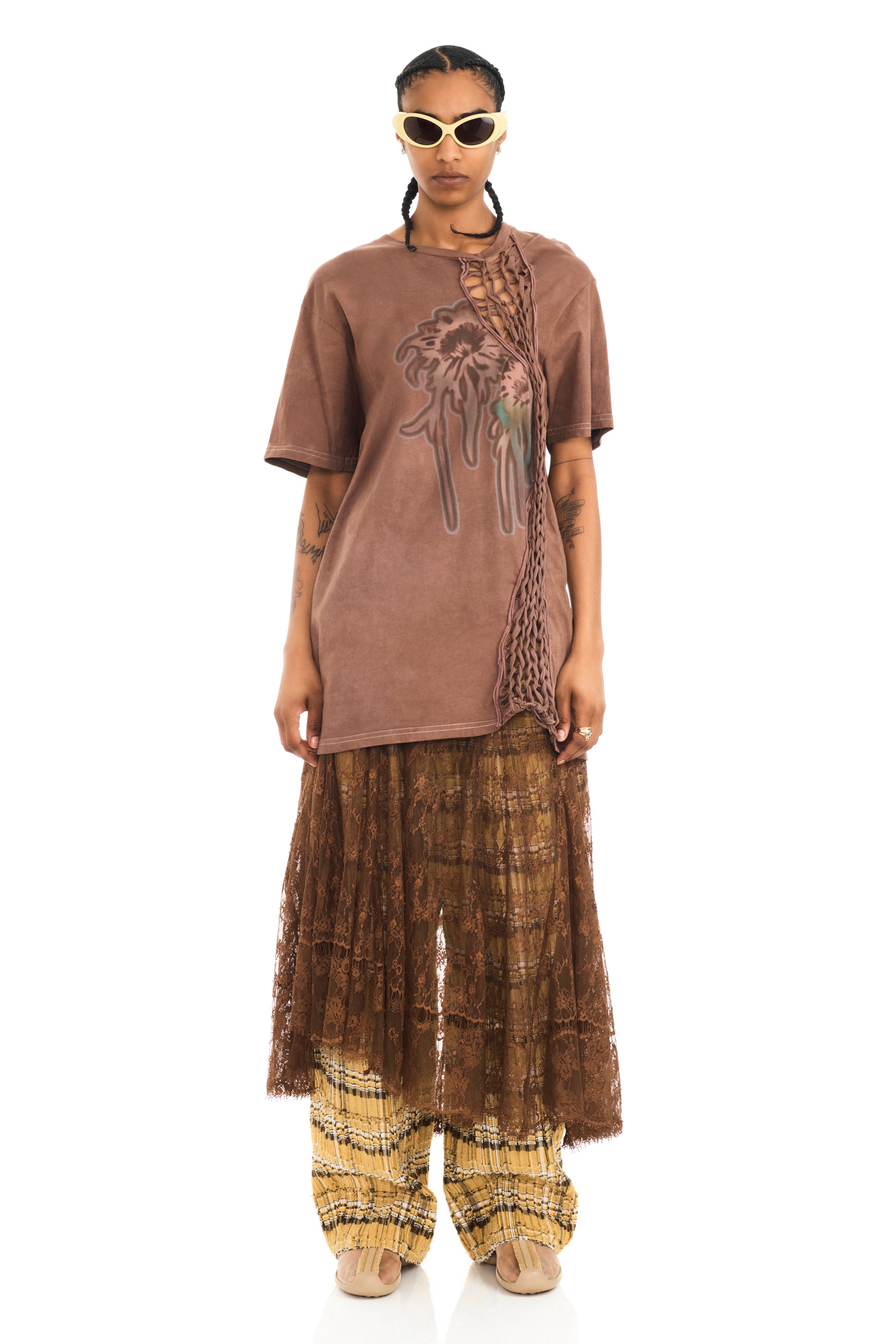 Tee with raw edge openings and knitted detail. Earth Faded Flower graphic on front.