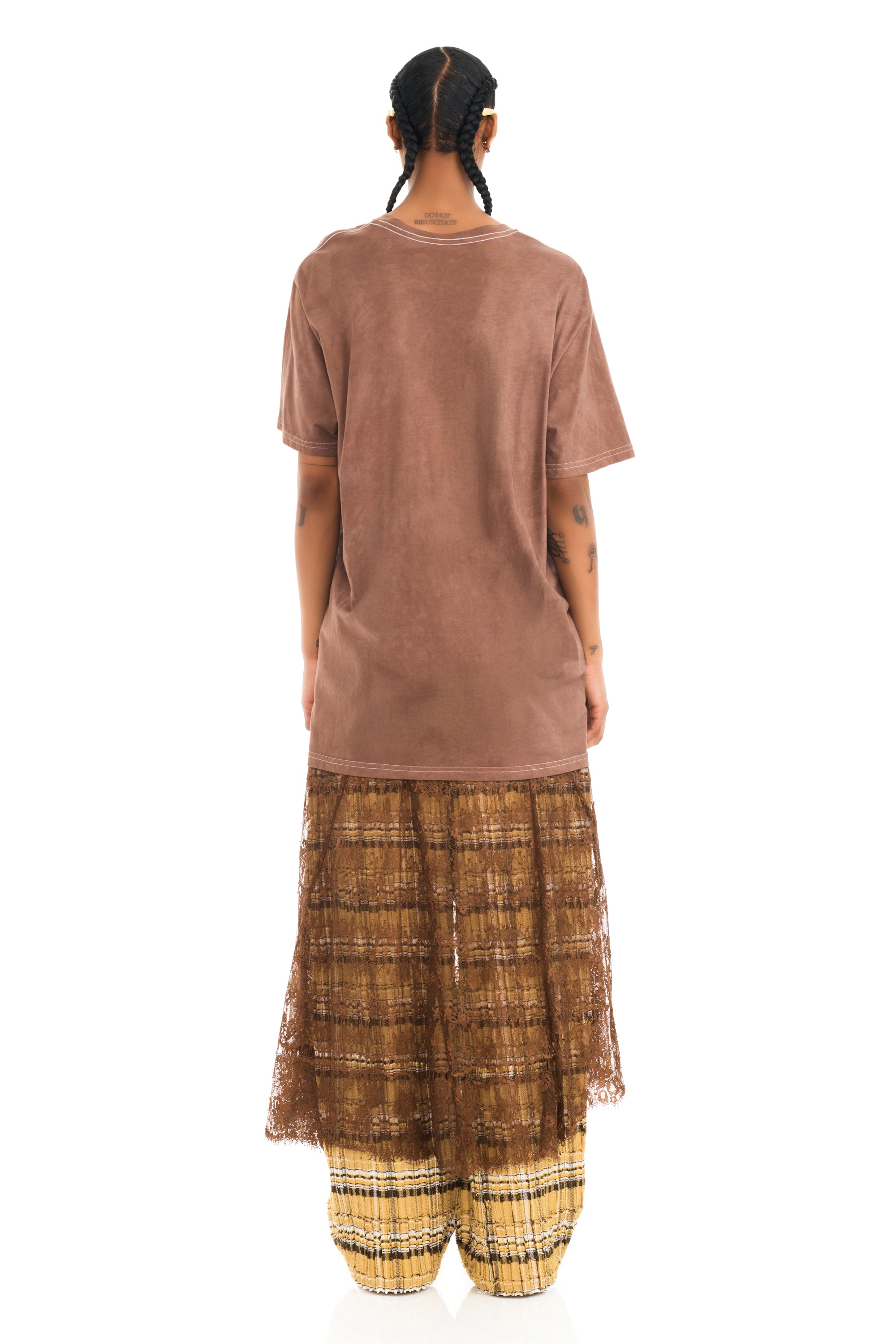 Tee with raw edge openings and knitted detail. Earth Faded Flower graphic on front.