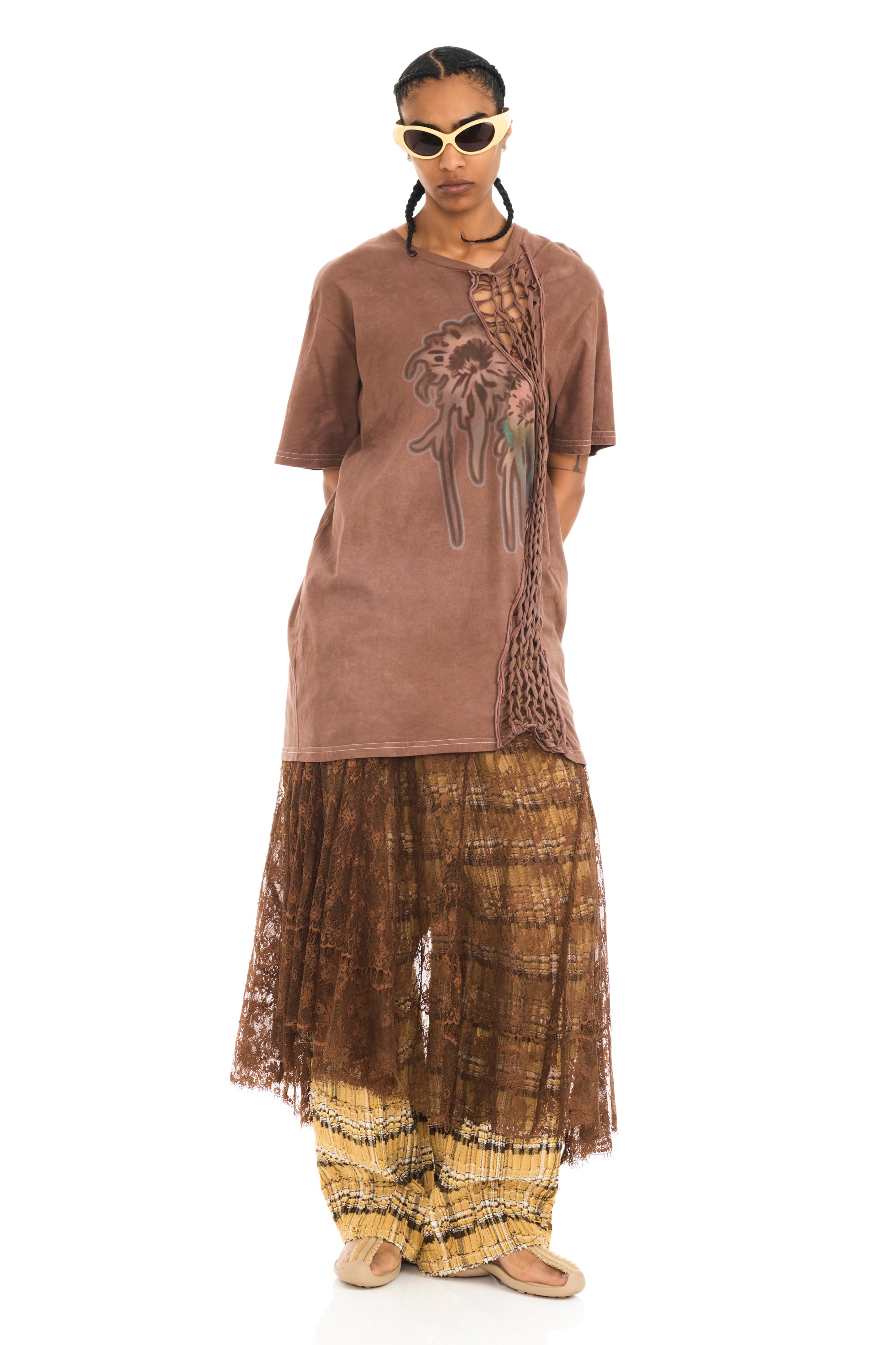 Tee with raw edge openings and knitted detail. Earth Faded Flower graphic on front.