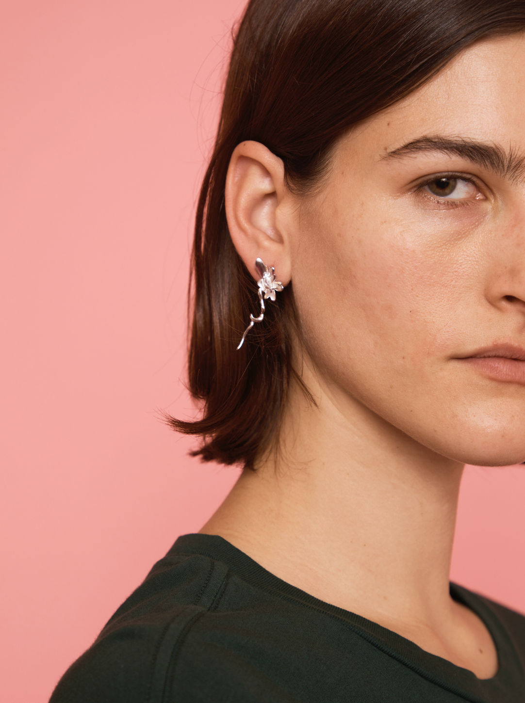 Sterling silver daisy earrings with crystal clear gemstones. Sterling silver stud back.
